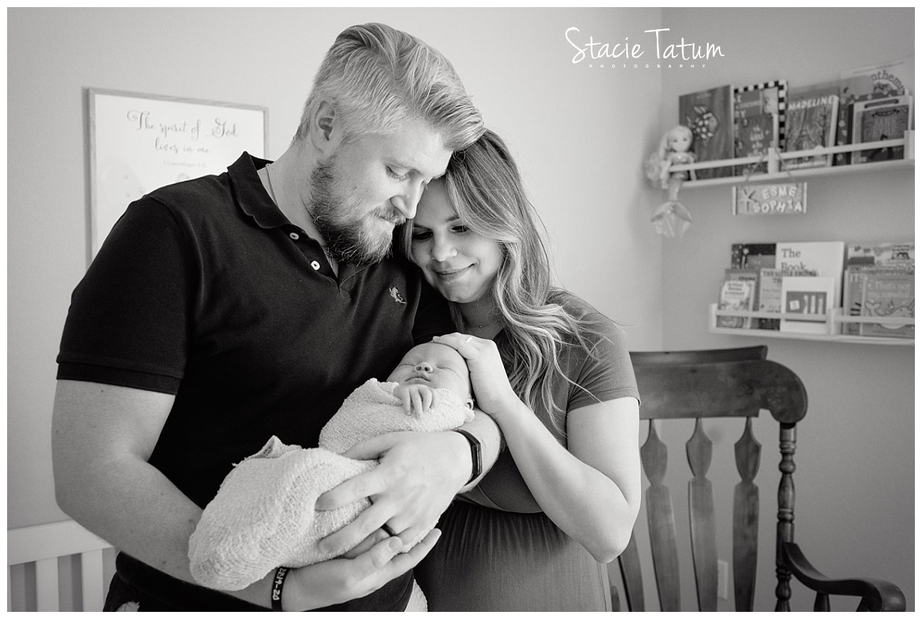 Dallas photographer mom and dad holding newborn baby.jpg