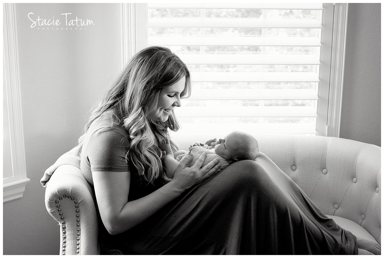 McKinney lifestyle newborn photography at home mom holding baby.jpg